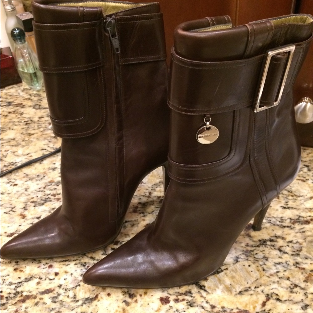 High heeled boots.  Brown leather.
